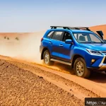 Home 20 모리타니 렌터카 이용법 - A rugged 4x4 SUV driving on a sandy and rocky desert road in Mauritania under a bright blue sky, wit...